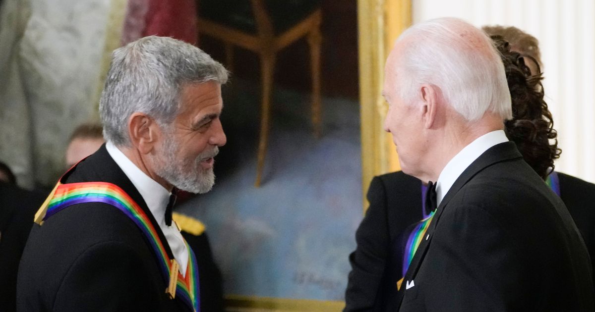 George Clooney and Joe Biden shaking hands at a White House reception