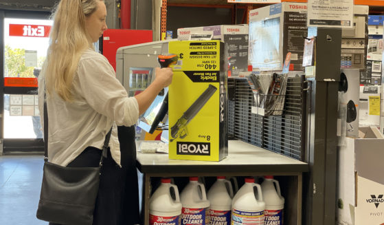 A customer makes a purchase in a self-checkout lane at a Home Depot store in San Rafael, California, last July. Another store, Dollar General, reportedly ended self-checkout at about 3,000 locations just last month.