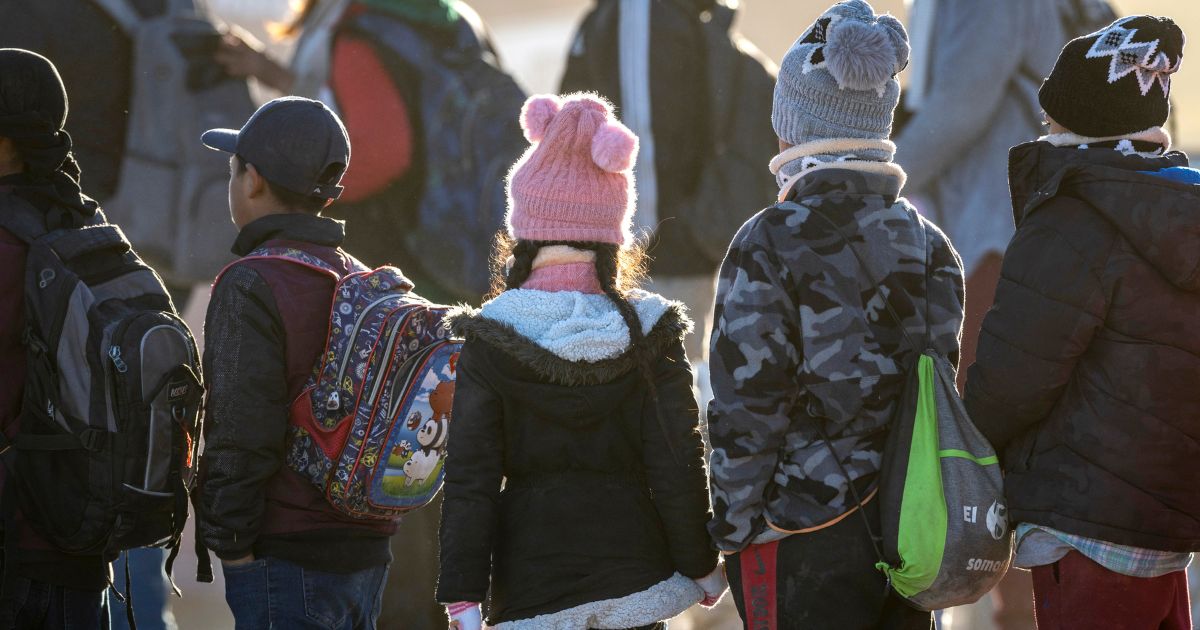 Ecuadorian immigrant children await transport from the U.S.-Mexico border in Lukeville, Arizona, on Dec. 7.